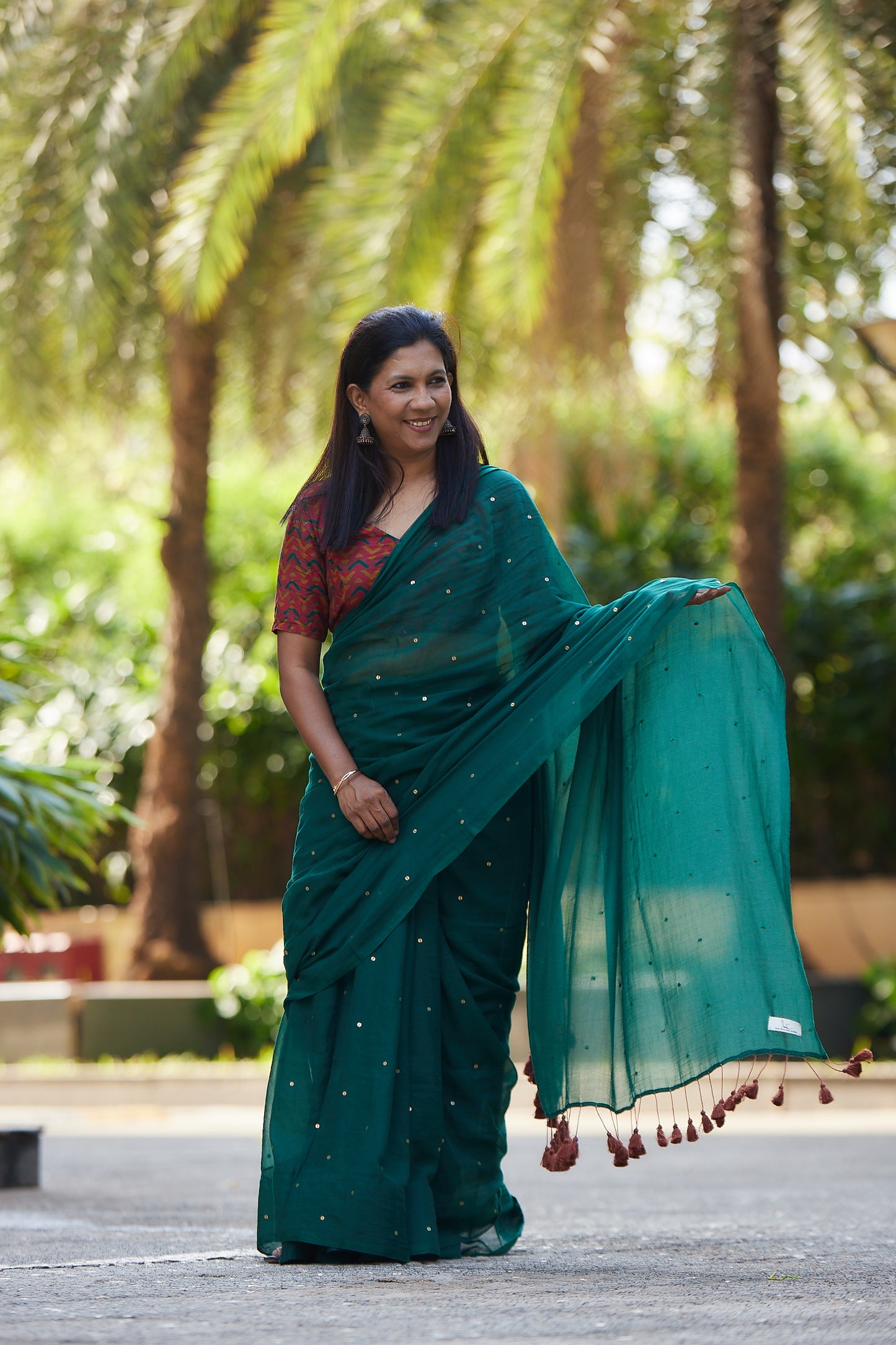Bottle Green Mulmul cotton Sequin Saree with Tassels