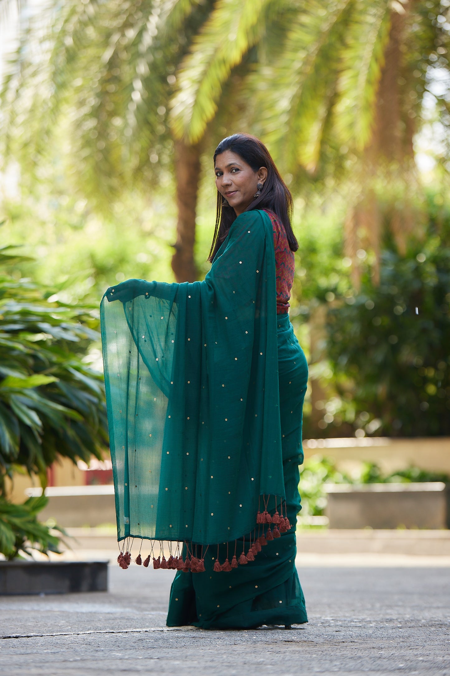 Bottle Green Mulmul cotton Sequin Saree with Tassels