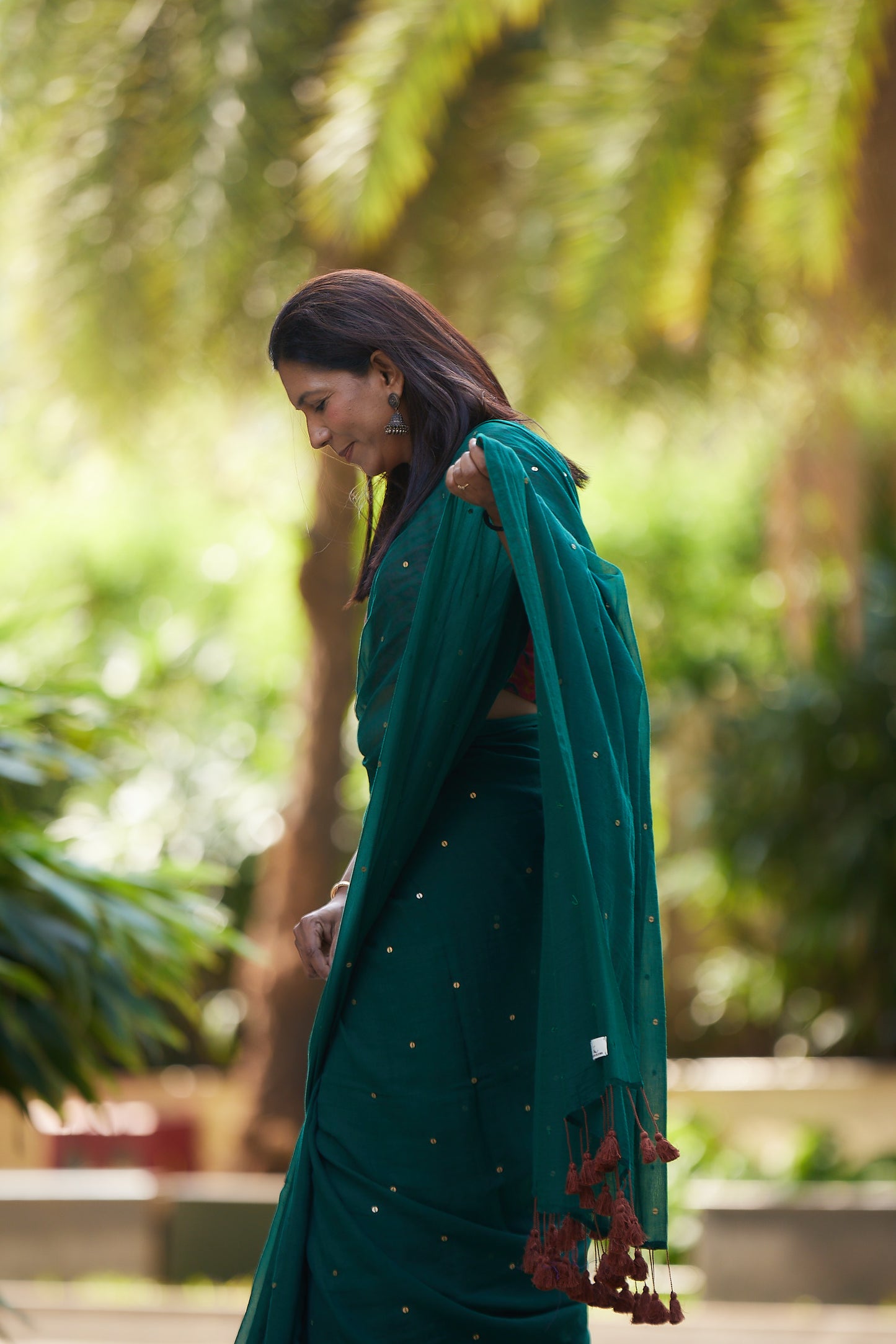Bottle Green Mulmul cotton Sequin Saree with Tassels