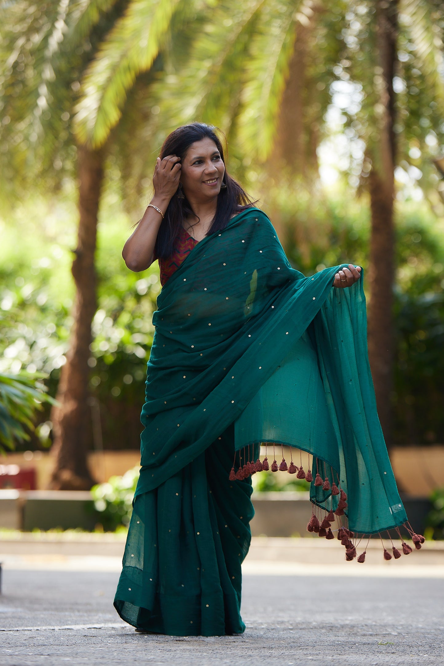 Bottle Green Mulmul cotton Sequin Saree with Tassels
