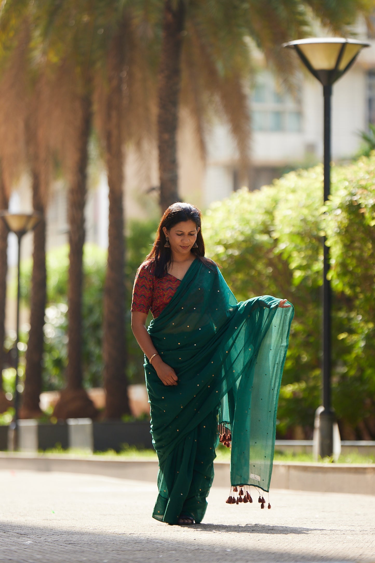 Bottle Green Mulmul cotton Sequin Saree with Tassels