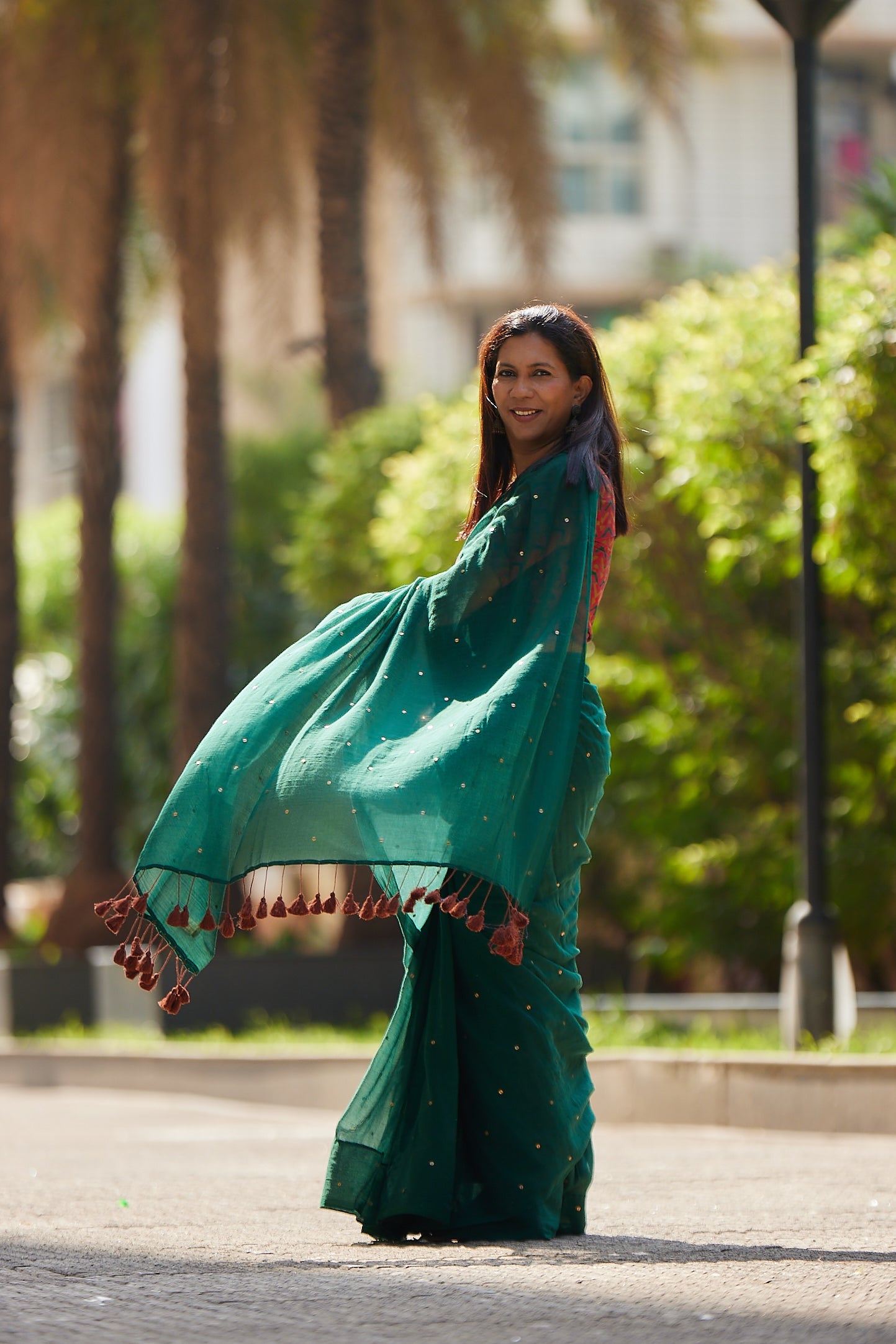 Bottle Green Mulmul cotton Sequin Saree with Tassels