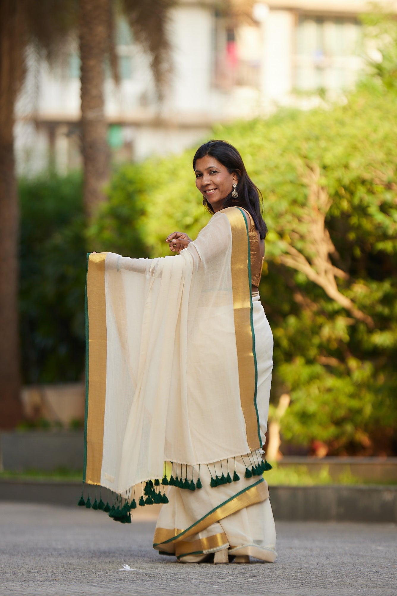 Off white Green Border Mulmul Cotton Saree with Tassels