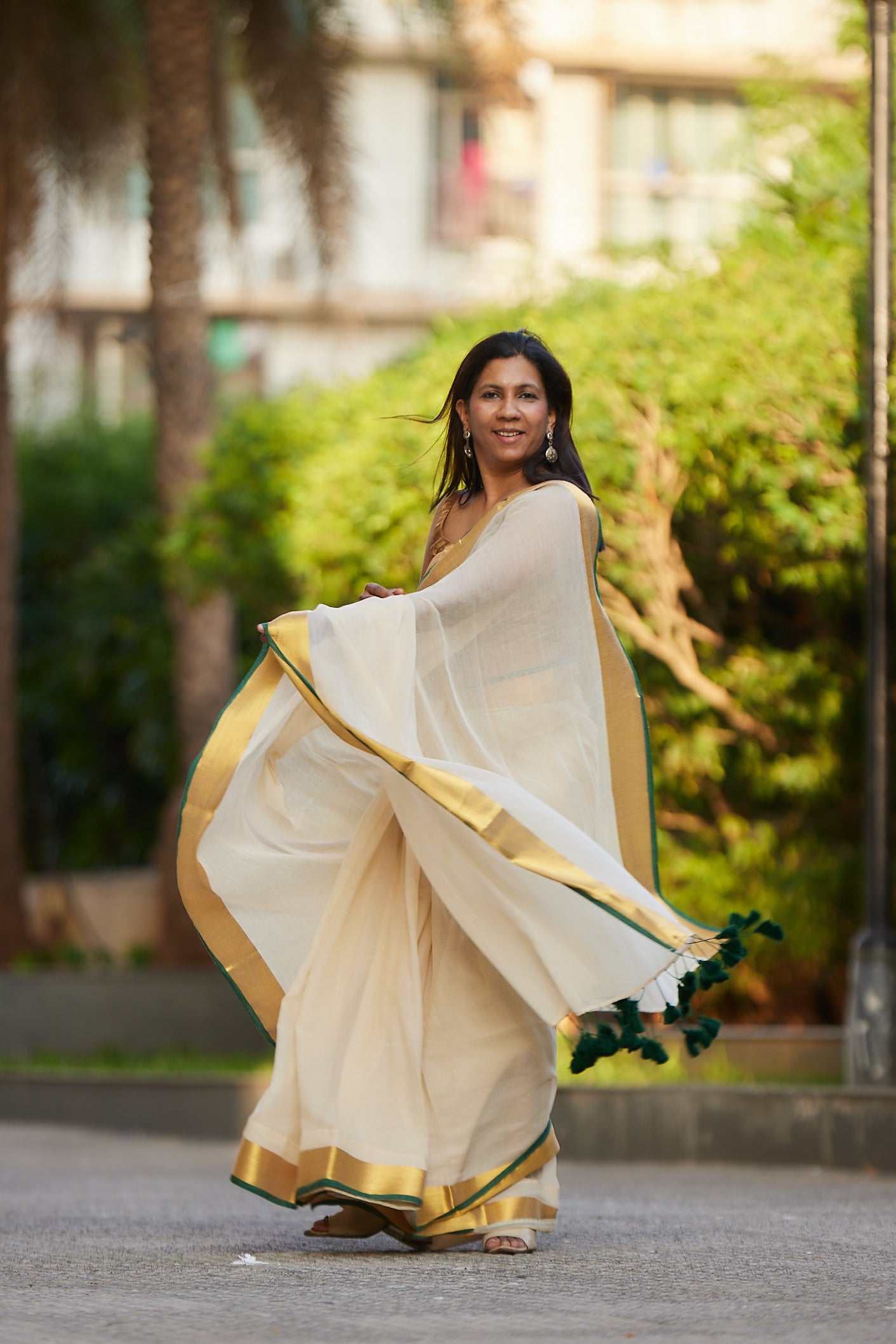 Off white Green Border Mulmul Cotton Saree with Tassels