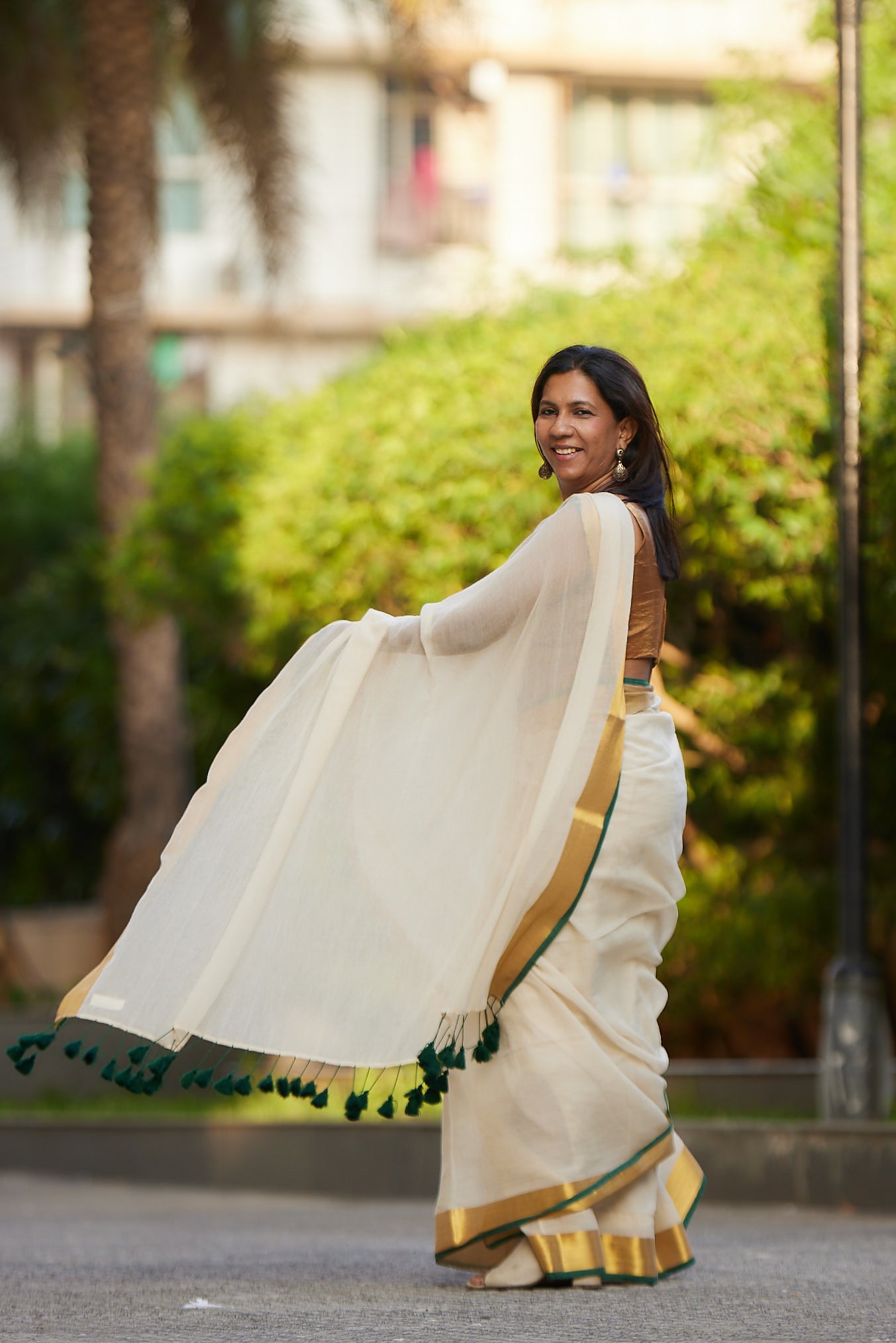 Off white Green Border Mulmul Cotton Saree with Tassels