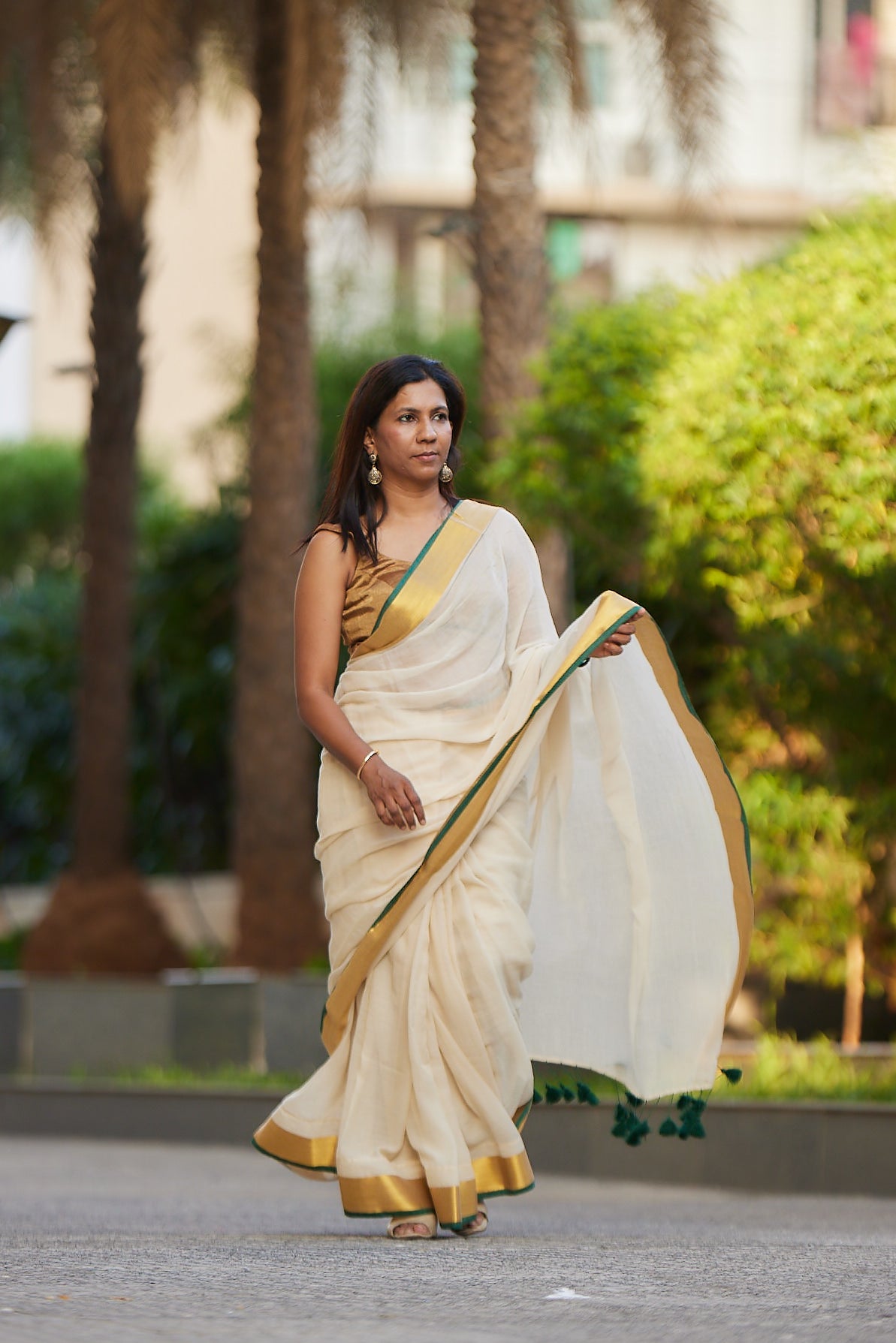 Off white Green Border Mulmul Cotton Saree with Tassels
