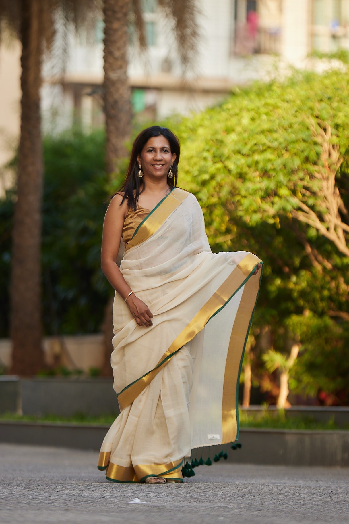 Off white Green Border Mulmul Cotton Saree with Tassels