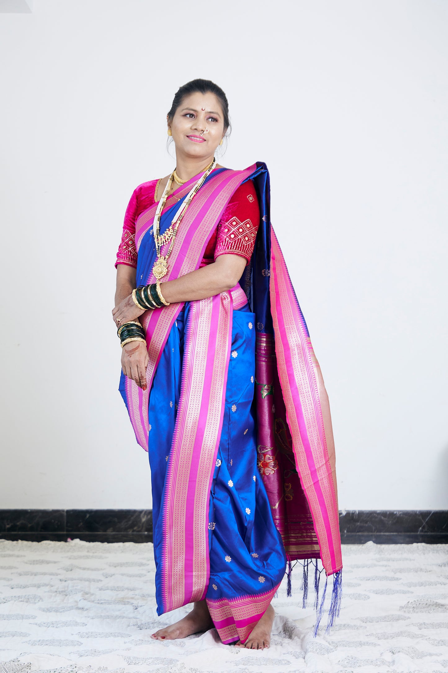 Rani & Royal Blue Nauvari Kanjivaram Silk blend Paithani Saree with unstitched blouse.
